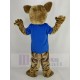 Braune Wildkatze Maskottchen Kostüm im blauen T-Shirt Tier
