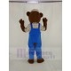 Teddybär Maskottchen Kostüm in blauen Overalls Karikatur